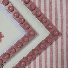 Load image into Gallery viewer, A close up detail of the two different sizes of the handcrafted pink bobbin framee