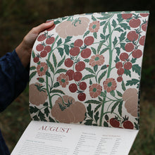 Load image into Gallery viewer, Floral patterned 2026 calendar with &#39;August&#39; on a blurred natural background