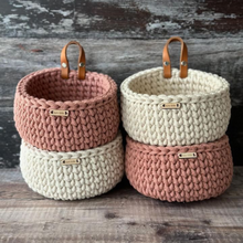 Load image into Gallery viewer, A group of stacked handmade mini baskets in natural and blush colours