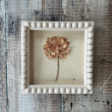 Load image into Gallery viewer, Framed artwork of a dried flower on a wooden surface