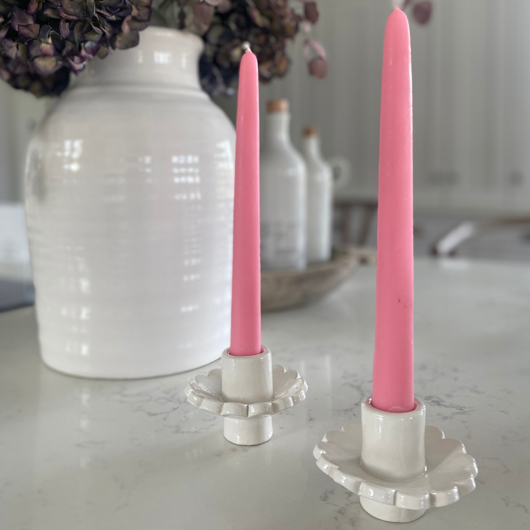 Handmade Scalloped Candle Holders by Sea Bramble Ceramics on a Kitchen Counter next to a jar of flowers