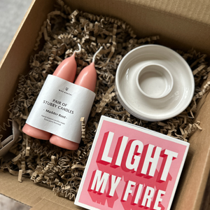 A gift box from Rhubarb & Hare with handmade candle holder, pink stubby candles from Wax Atelier and Light My Fire matches from Archivist Gallery