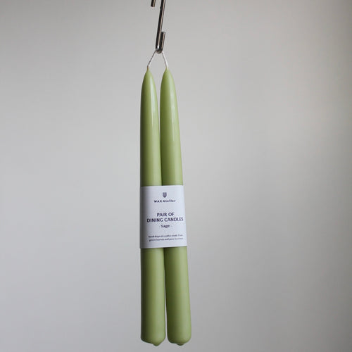 A pair of dining candles from wax Atelier in their sage collection