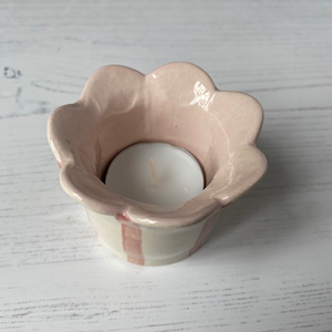 The pastel pink inside of the Handmade Tealight Holder  - Daisy Scalloped Edge by Sea Bramble Ceramics