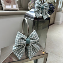 Load image into Gallery viewer, handmdade gingham bows atop candle lanterns in an orangery