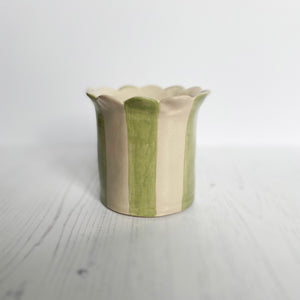 The Handmade sage green daisy scalloped planter from Sea Bramble Ceramics