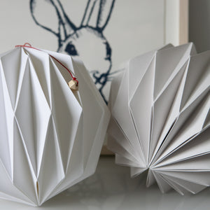 Hand folded paper lights in pale grey and white