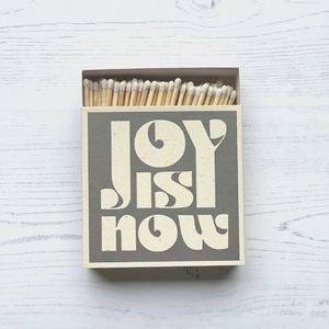 Luxury large square matches Designed, printed and assembled in the UK.  Feature the phrase 'Joy Is Now'