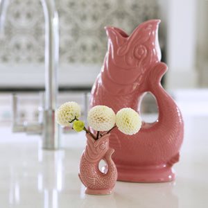 A mini and a large gluggle jug in pink