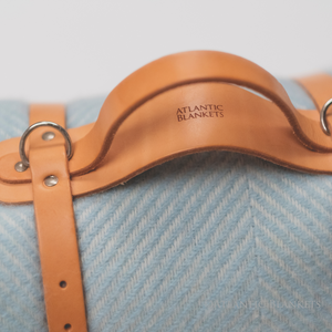 A close up of the beautifully crafted leather carry strap which comes with every Atlantic Blanket picnic blanket sold by Rhubarb & Hare