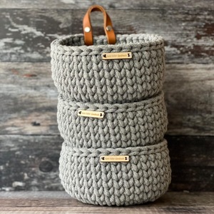 A trio of handmade crochet baskets by Kate Keller Handmade.  The Classic Mini size in steel grey