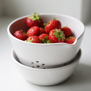 Handmade Berry Bowl in a White Rustic Glaze filled with strawberries.  Shows the plate that comes with the bowl