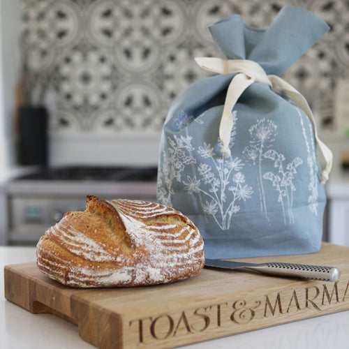 Breathable linen bread bag handmade in a duck egg blue colour with garden design from the studios of Helen Round in Cornwall