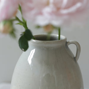 The beautiful handle detail of these handmade rustic bud vases in a gorgeous blue/grey celadon glaze