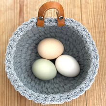 Load image into Gallery viewer, Eggs in the handmade crochet basket by Kate Keller Handmade.  The mini classic size in steel grey