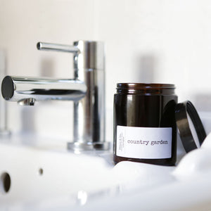 The Country Garden candle by Ethel & Co in a bathroom setting