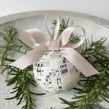 Load image into Gallery viewer, Handmade Paper Bauble using Vintage Music Sheets and complete with a satin ribbon bow in griege