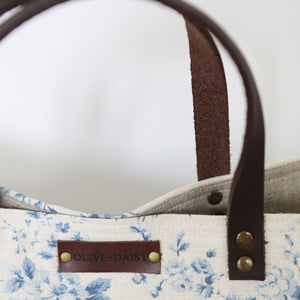 The Handmade Olive & Daisy Tote Bag in Aegean Country Rose Linen with a chocolate leather strap