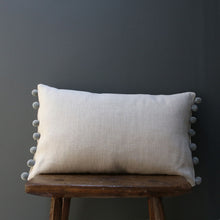 Load image into Gallery viewer, Handmade by Catkin &amp; Olive these cushions are in Peony &amp; Sage&#39;s chunky linen in natural with pom poms in Natural Fog.   A pair would sit beautifully on your bed, or a single one would look lovely on an armchair.  