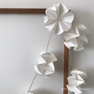 A string of 10 x fairy lights handmade with white paper flowers by Folded Side Project