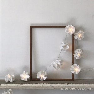 A string of 10 x fairy lights handmade with white paper flowers by Folded Side Project