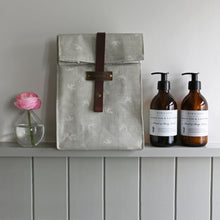 Load image into Gallery viewer, Handmade wash bag with a chocolate leather strap and Olive &amp; Daisy fabric