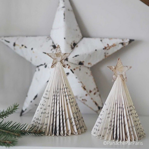 Handfolded paper tree as Christmas decoration - one large tree and one small, each adorned with a little star at the top