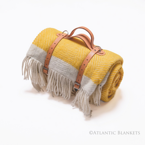 A yellow herringbone wool picnic blanket, made in North Cornwall by Atlantic Blankets